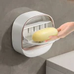 Wall Mounted Soap Dish Waterproof Punch-Free Bathroom Drain Soap Box Wall Mounted Flip Soap Holder Back to products Fashion With Drainage Box Soap Dish Waterproof Punch-Free Bathroom Drain Soap Box Wall Mounted Flip Soap Holder ৳ 340.41 – ৳ 345.33Price range: ৳ 340.41 through ৳ 345.33  Color	 Choose an option Fashion With Drainage Box Soap Dish Waterproof Punch-Free Bathroom Drain Soap Box Wall Mounted Flip Soap Holder quantity 1 Add to cart Buy now Add to compare   Add to wishlist SKU: dae2542gnrvg00cl1pag Category: Baby Care Share: Save Description Additional information Reviews (0) SPECIFICATIONS   Brand Name: NONE  Certification: NONE  Choice: yes  Dish Material: Plastic  High-concerned chemical: None  Origin: Mainland China  Type: Soap Dishes  semi_Choice: yes      Brand New and High Quality Type: Soap Dish Material: ABS Color: White,Light Green,Green Size: 12.1*12.3*5cm(4.76*4.84*1.97in)  Package includes: 1*Waterproof Soap Dish  Feature: 1.If you are used to bathing with soap, whether the soap is often wet with water and becomes sticky, the use time is very short, and the soap has to be changed frequently. You need a waterproof soap dish with drainage box to help you solve this trouble. 2.DOUBLE-LAYER SOAP DISH: The soap bar holder has two layers, the upper layer drains water quickly, and the lower tray accumulates water, so the soapy water does not leak, keeping the table clean and tidy. Don’t worry about the soap getting flooded or turning mushy. 3.STURDY AND DURABLE: The bar soap holder is made of thickened ABS material, which is sturdy and durable, ideal for use in the bathroom, shower or tub. 4.STRONG STICKINESS: very easy to install, no need to drill the wall. Strong stickiness, it will not fall easily even in wet environment. 5.EASY TO CLEAN: You can disassemble the whole soap box, disassemble the upper and lower layers, and perform a thorough cleaning, which is very convenient. 6.STYLISH LOOK: The wall mounted soap holder features smooth lines and luxurious colors to give your bathroom a more upscale and elegant look.  Tips: 1. Due to the light and monitors effect, colors may have lightly difference. 2. Please allow slightly size errors due to manual measurement. Thank you for your understanding! - Image 5